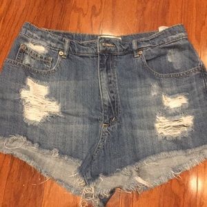 High-waisted distressed denim shorts